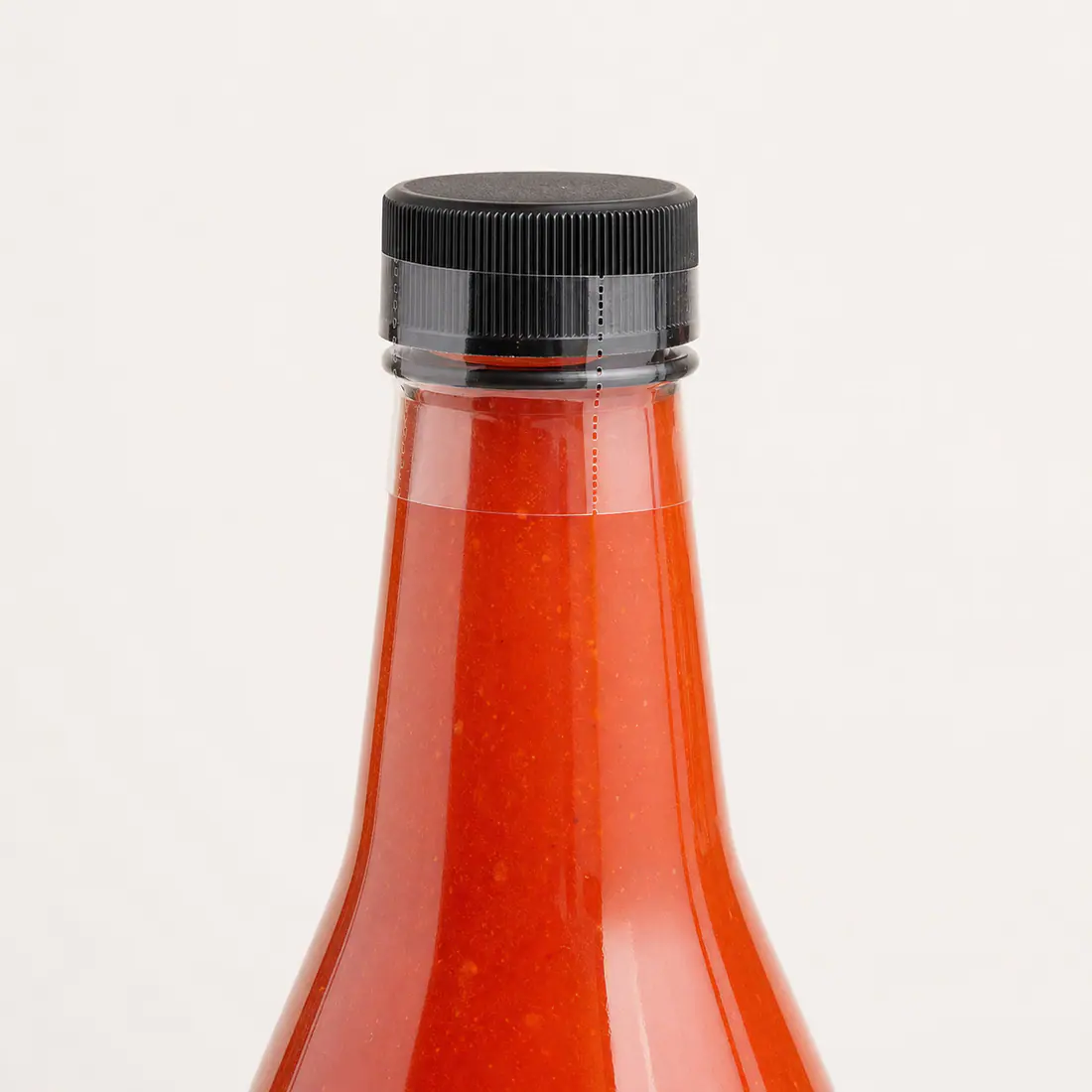 Bouteilles pour sauce piquante avec témoin d'ouverture détail du bouchon et de l'étanchéité